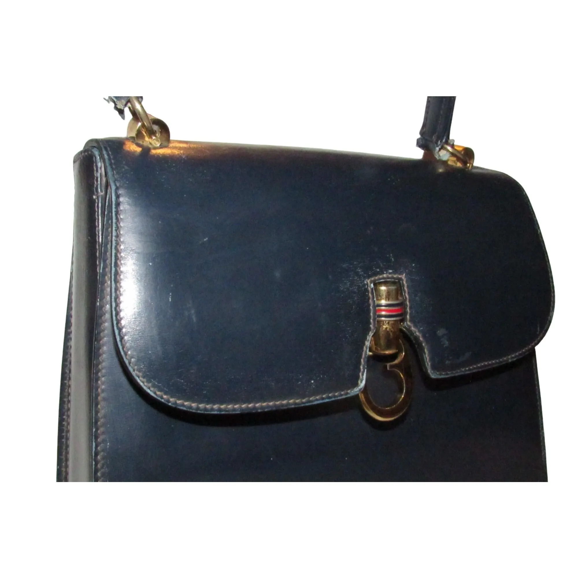 One of a kind, early Gucci, 1960's mod, hard and boxy, structured, navy leather, top handle shoulder bag with gold, equestri
