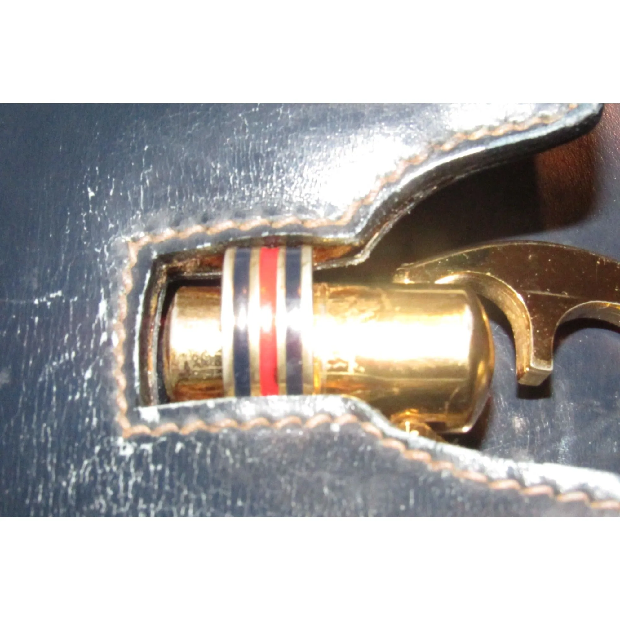 One of a kind, early Gucci, 1960's mod, hard and boxy, structured, navy leather, top handle shoulder bag with gold, equestri