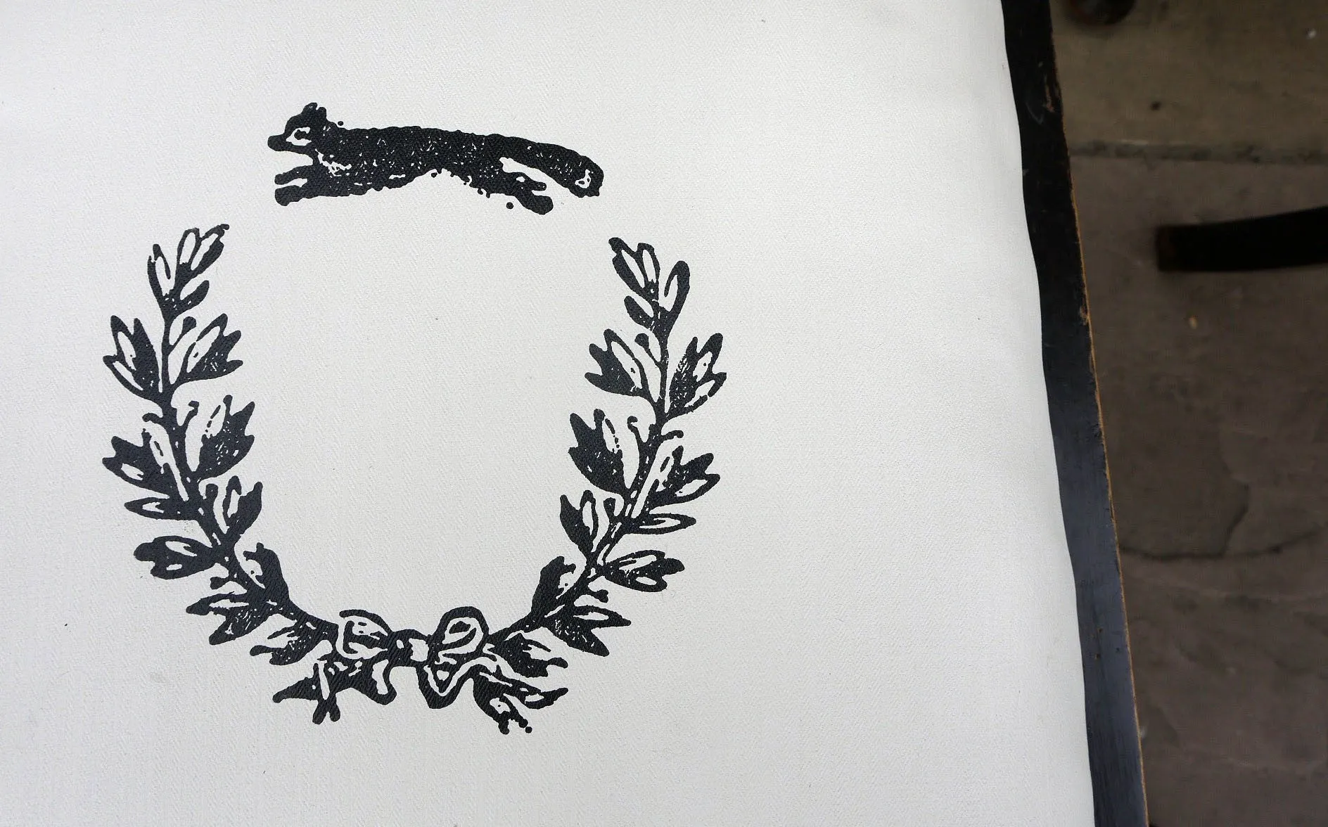 Set of four wooden vintage dining chairs with updated seat pads with a fox and wreath design.