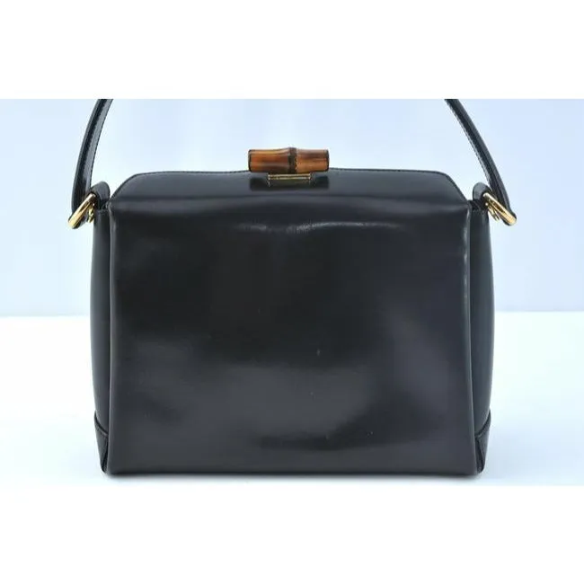 Tom Ford era, Gucci, midnight blue leather, roomy, Bamboo line, two-way top-handle shoulder purse with a bamboo clasp, gold tone hardware, a snap top closure, and a removable strap