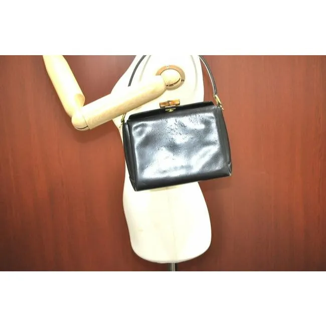 Tom Ford era, Gucci, midnight blue leather, roomy, Bamboo line, two-way top-handle shoulder purse with a bamboo clasp, gold tone hardware, a snap top closure, and a removable strap